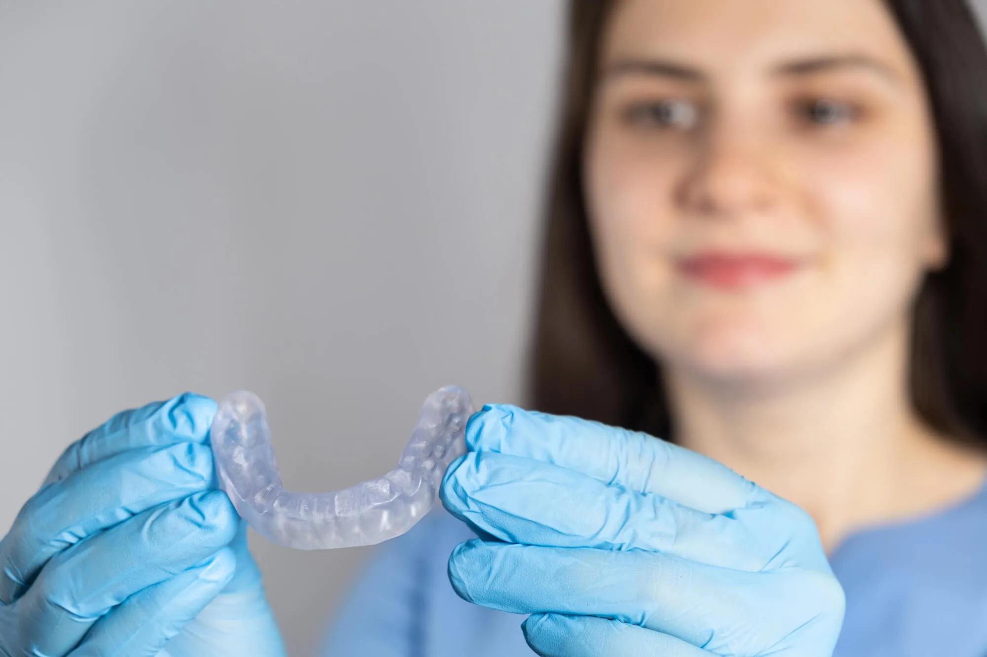Dentists who take Medicare in Fort Lauderdale holding Invisalign