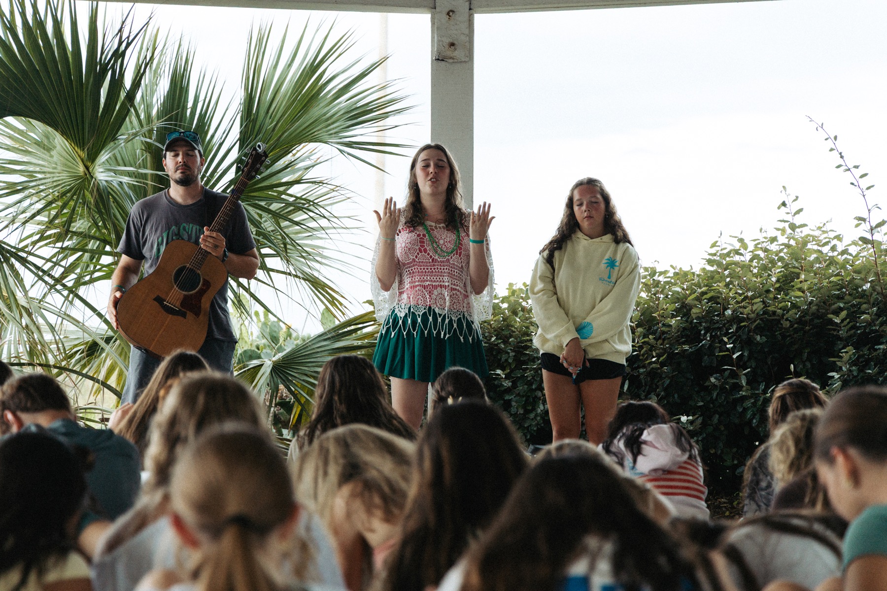 Students and a youth leader talking together outside at BigStuf 2026