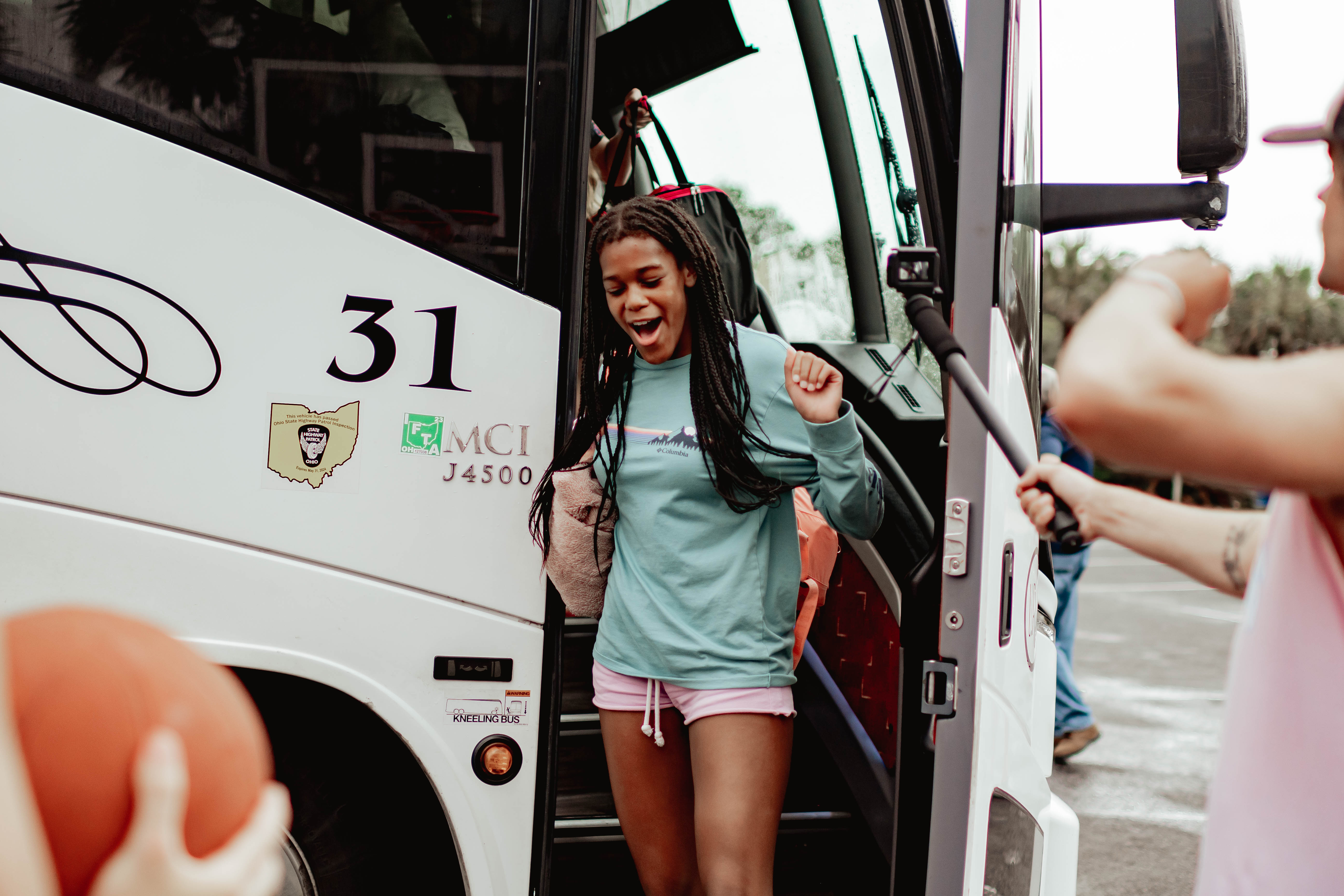Students arriving at BigStuf camp by bus