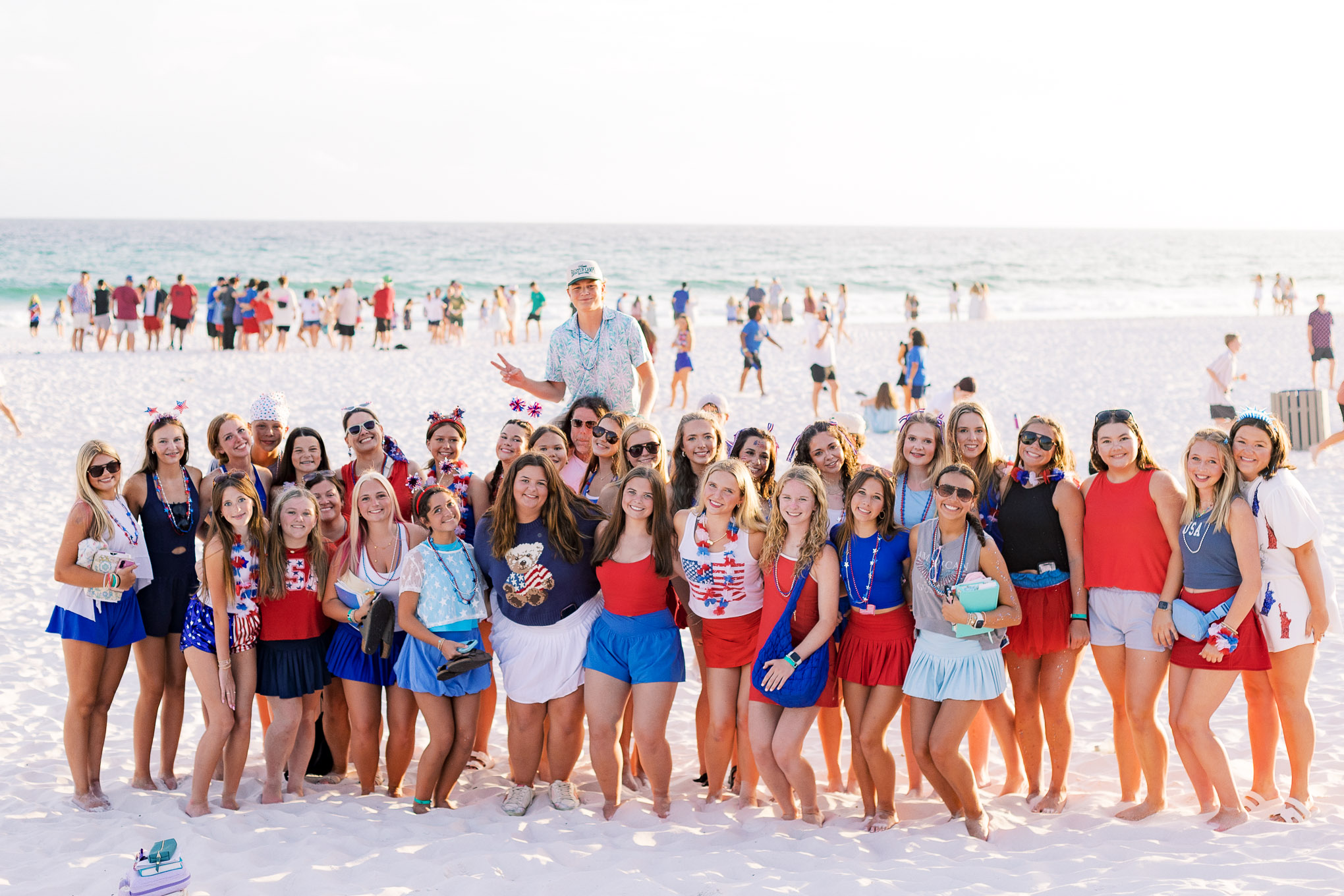 Students gathering on the beach