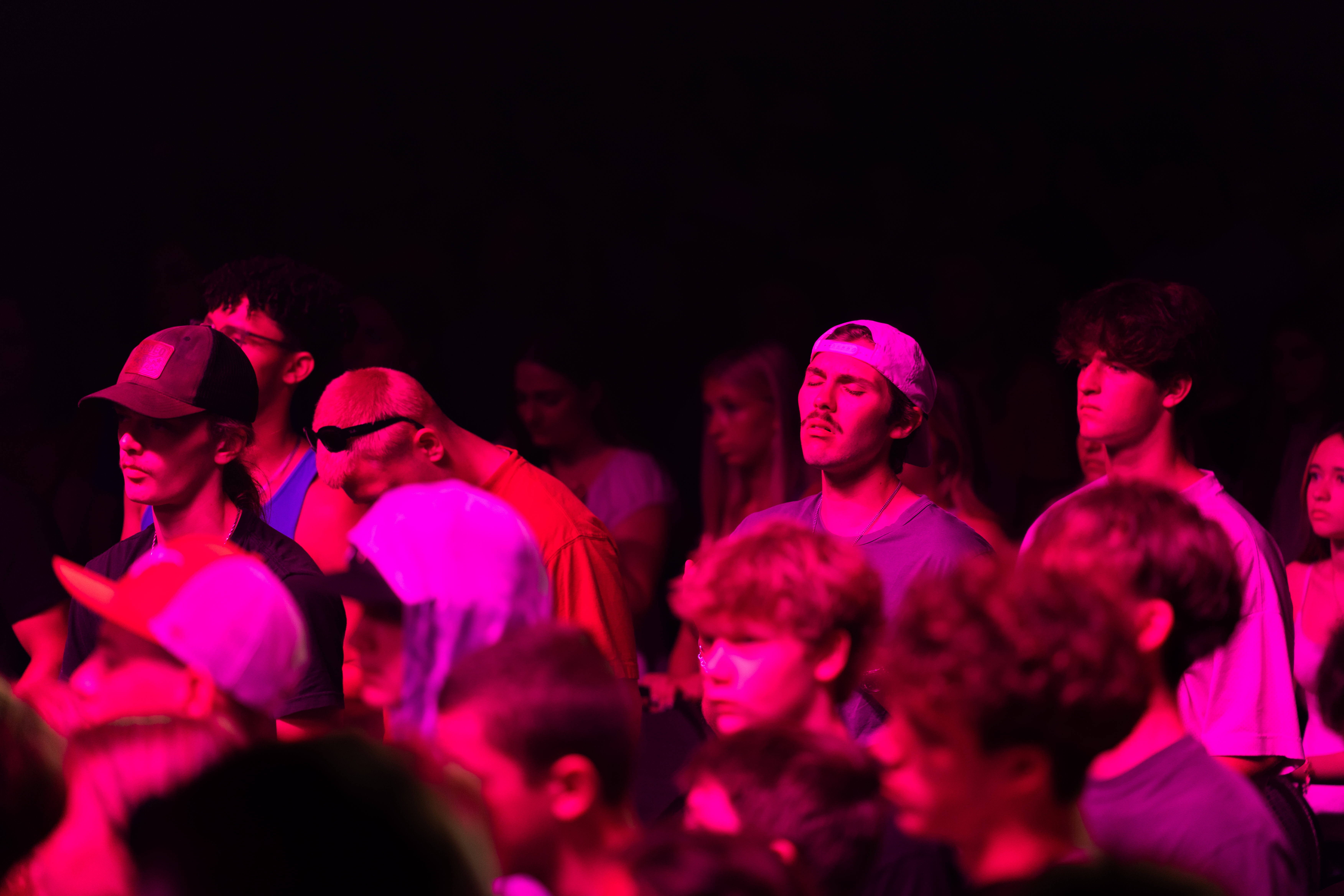 Students worship during a packed BigStuf session