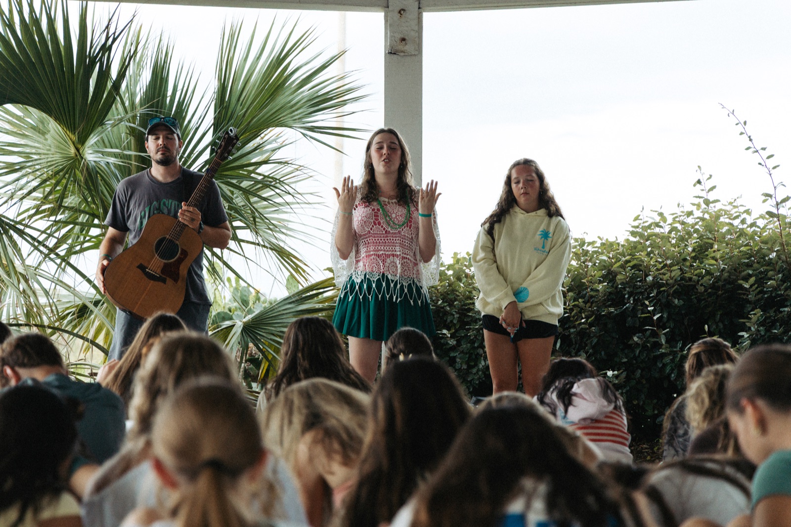 Students listening during an outdoor BigStuf gathering