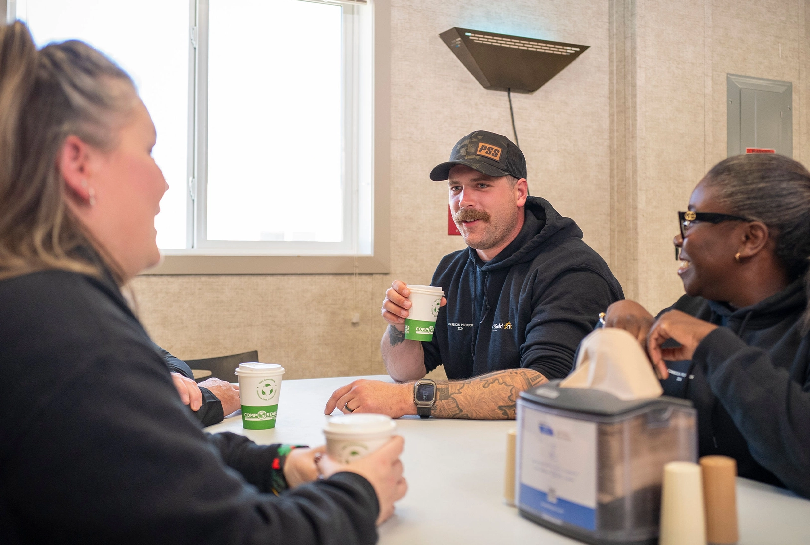 Team members enjoying some downtime in the dining hall. 