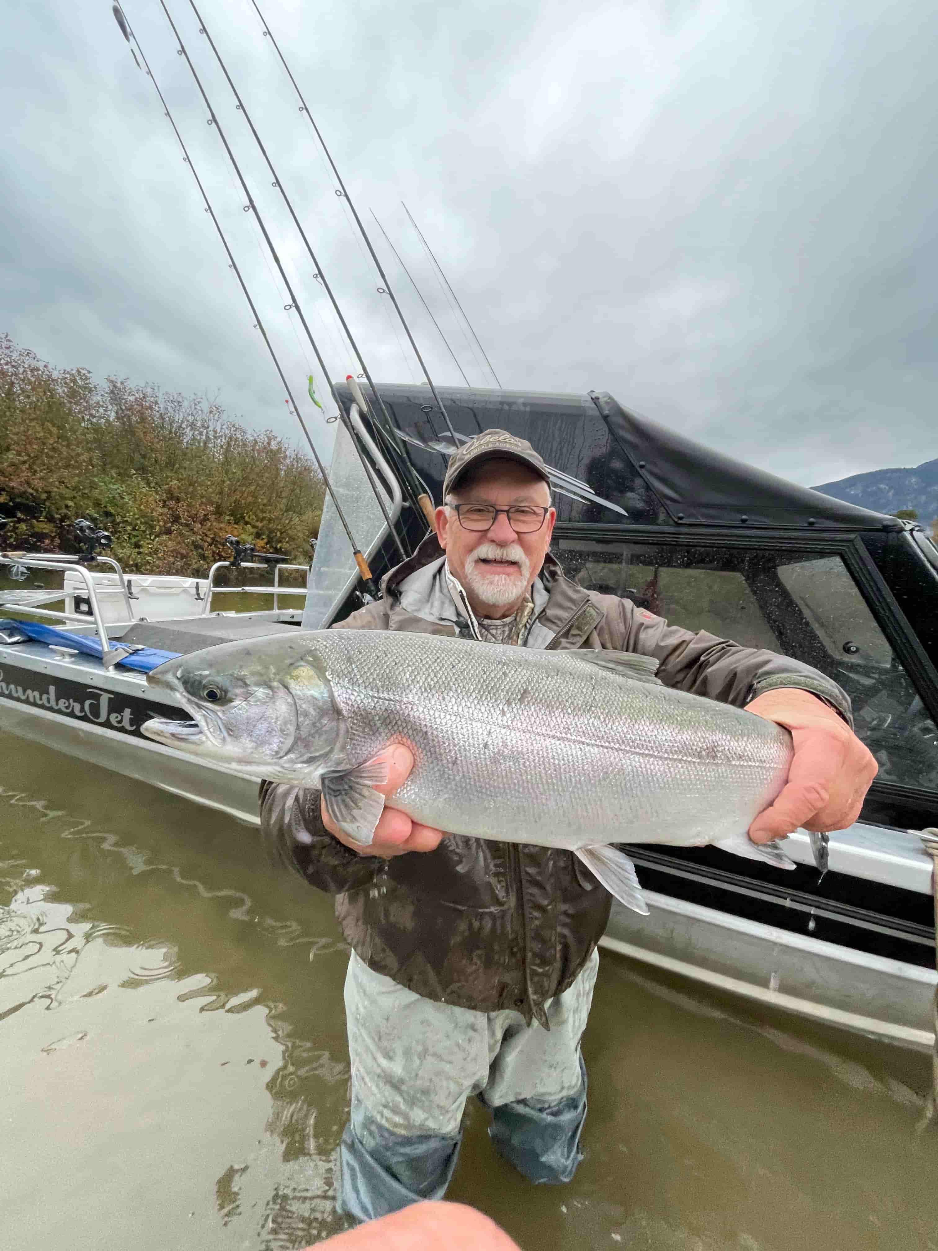 A man holding a coho