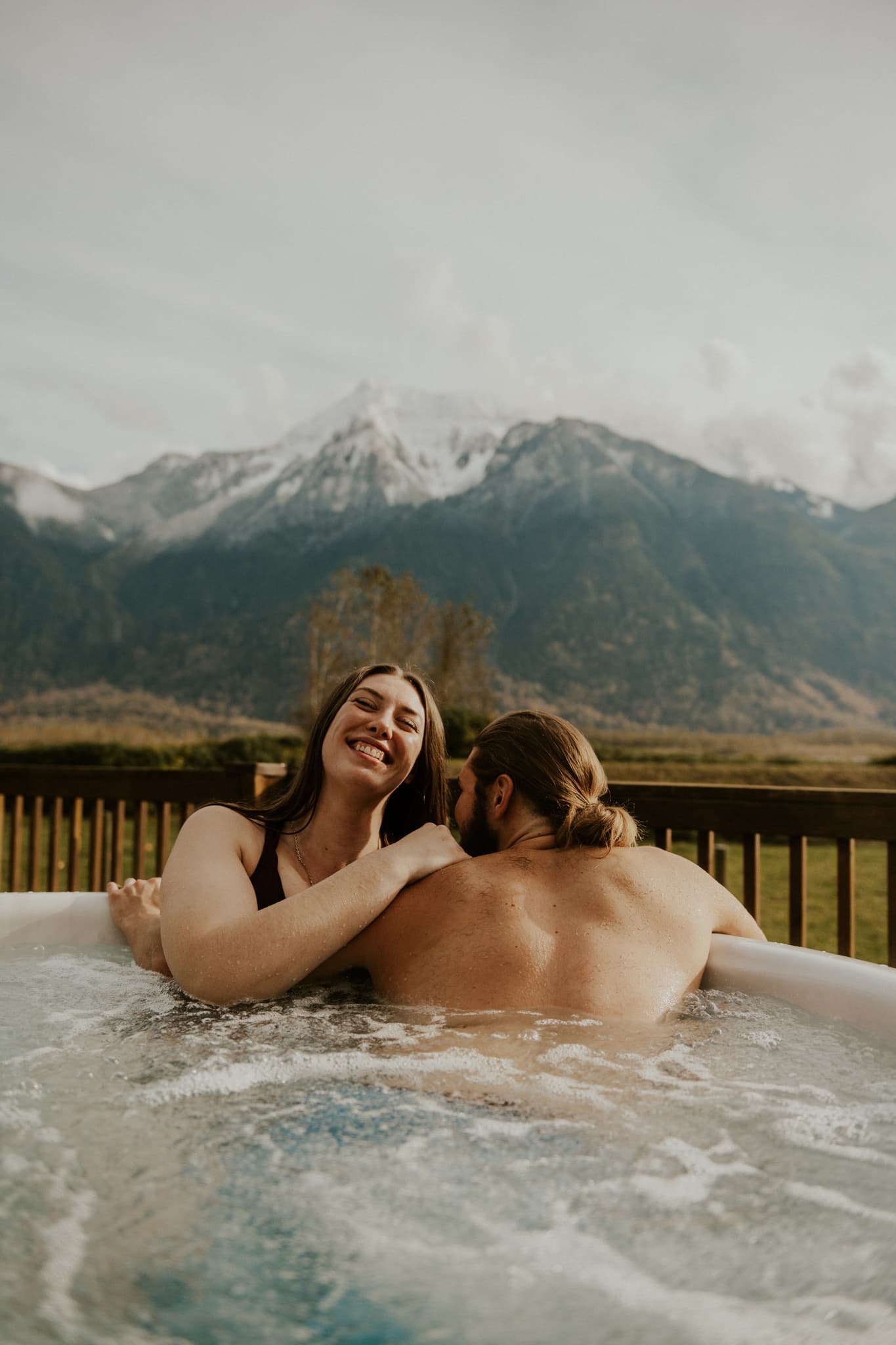 A couple enjoying a hot tub at the Fraser River Lodge 