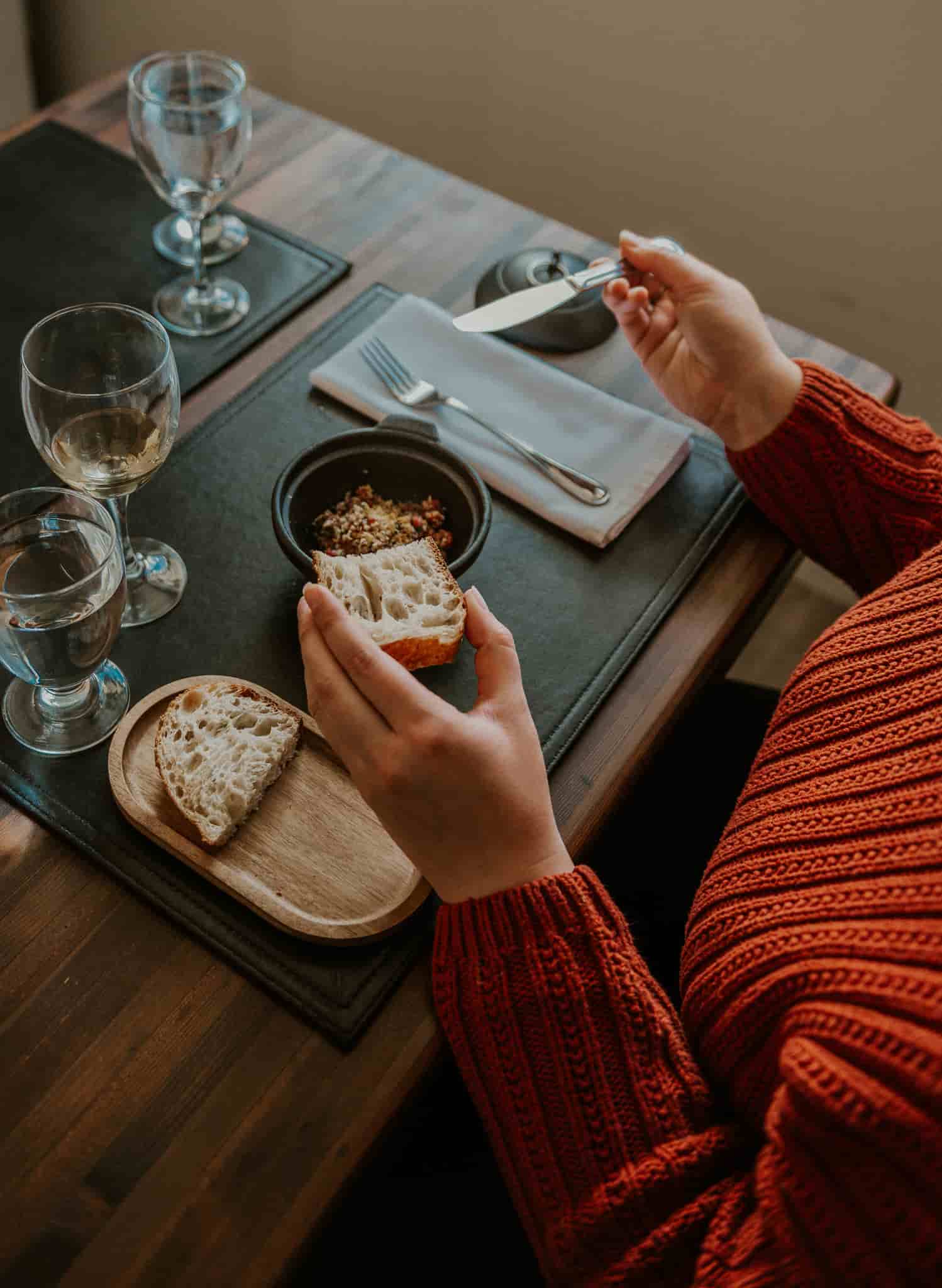 A woman eating dinner at the lodge