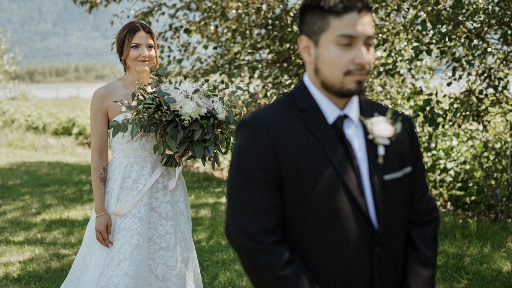 A bride walking up to the groom for their first look