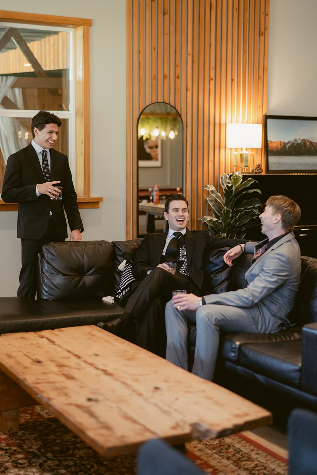 A groom and his groomsmen enjoying a drink in the Games Room at the Fraser River Lodge