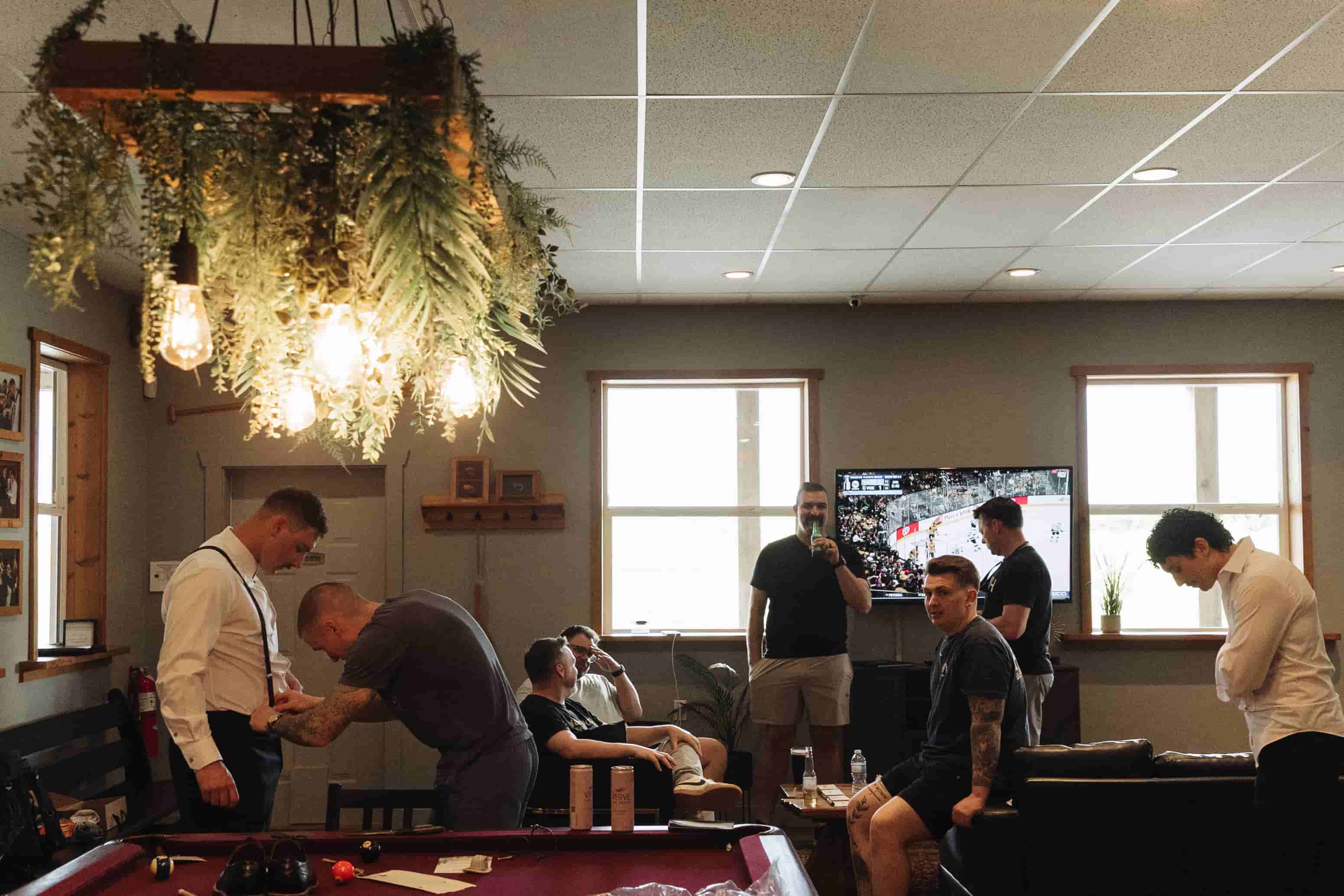 A wedding party getting ready for the day in the Fraser River Lodge's games room 