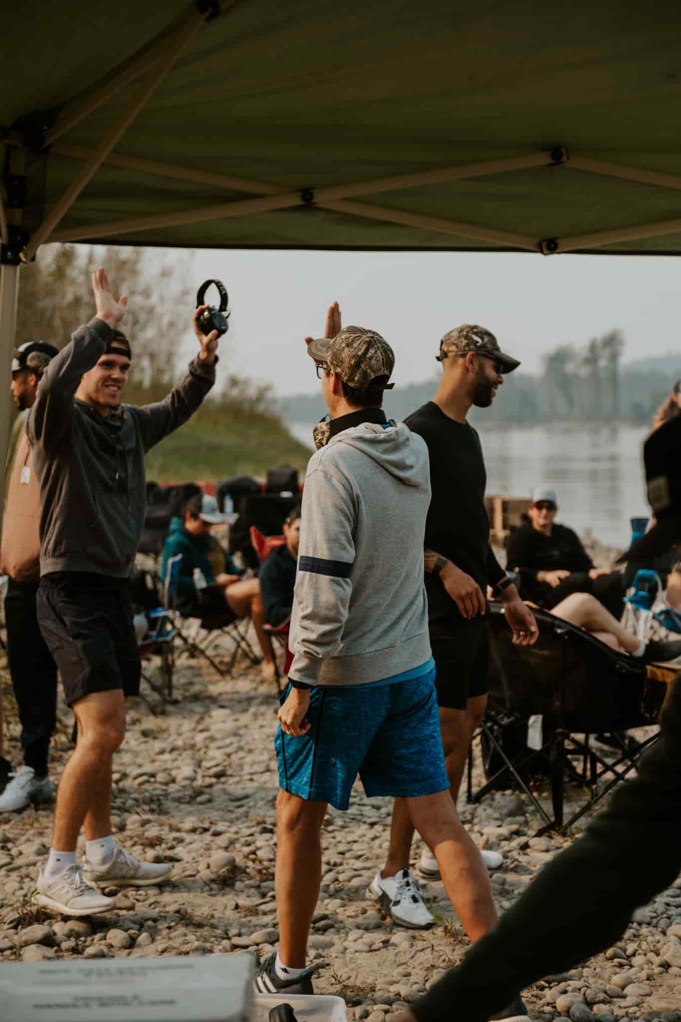 Two men high fiving after a team activity