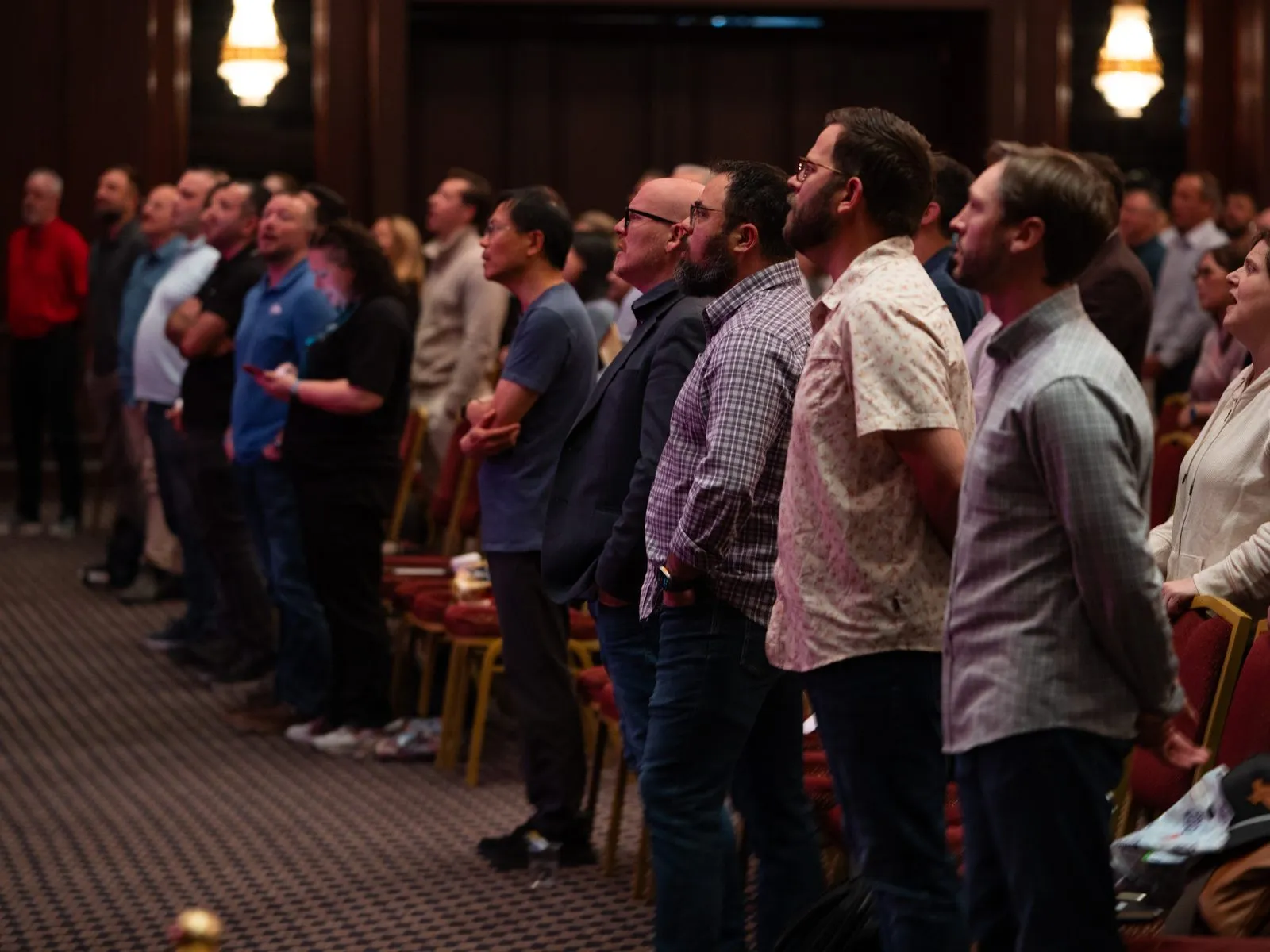 Attendees standing together in the Nicea Conference hall