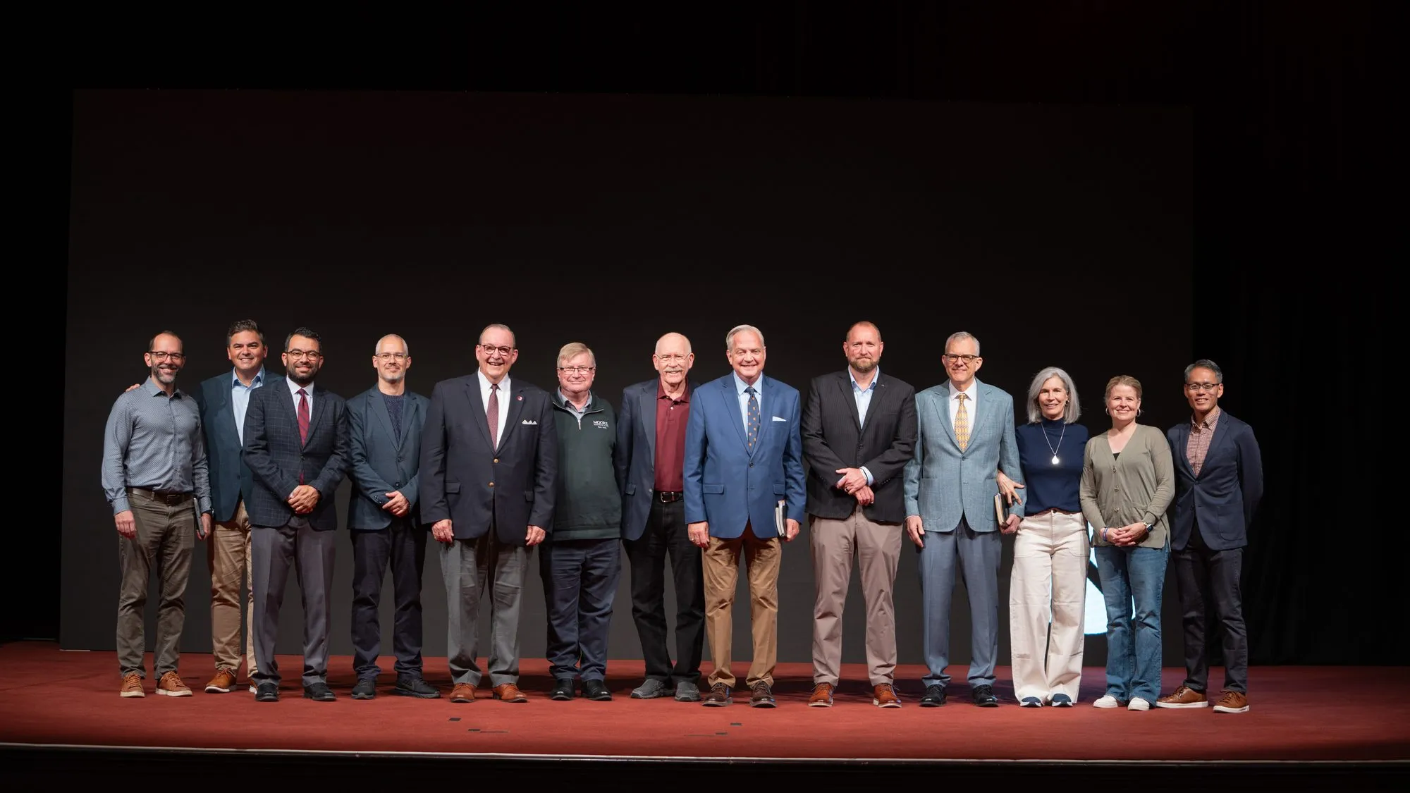 Nicea Conference speakers standing together on stage