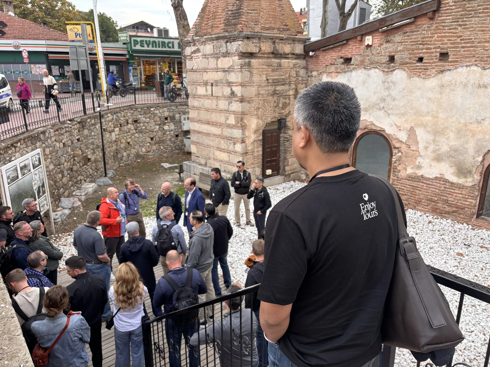 Enjoy Tours group gathered at an old brick and stone site in Iznik