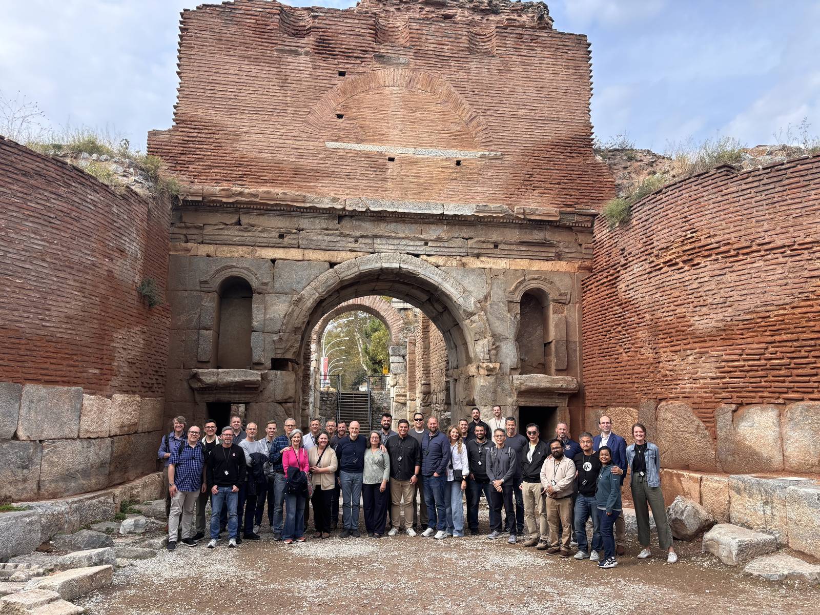 Nicea Conference group in front of an old Roman brick gate in Iznik