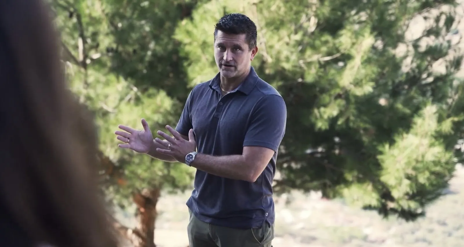 Greg Gilbert speaking outdoors on why to visit the biblical sites