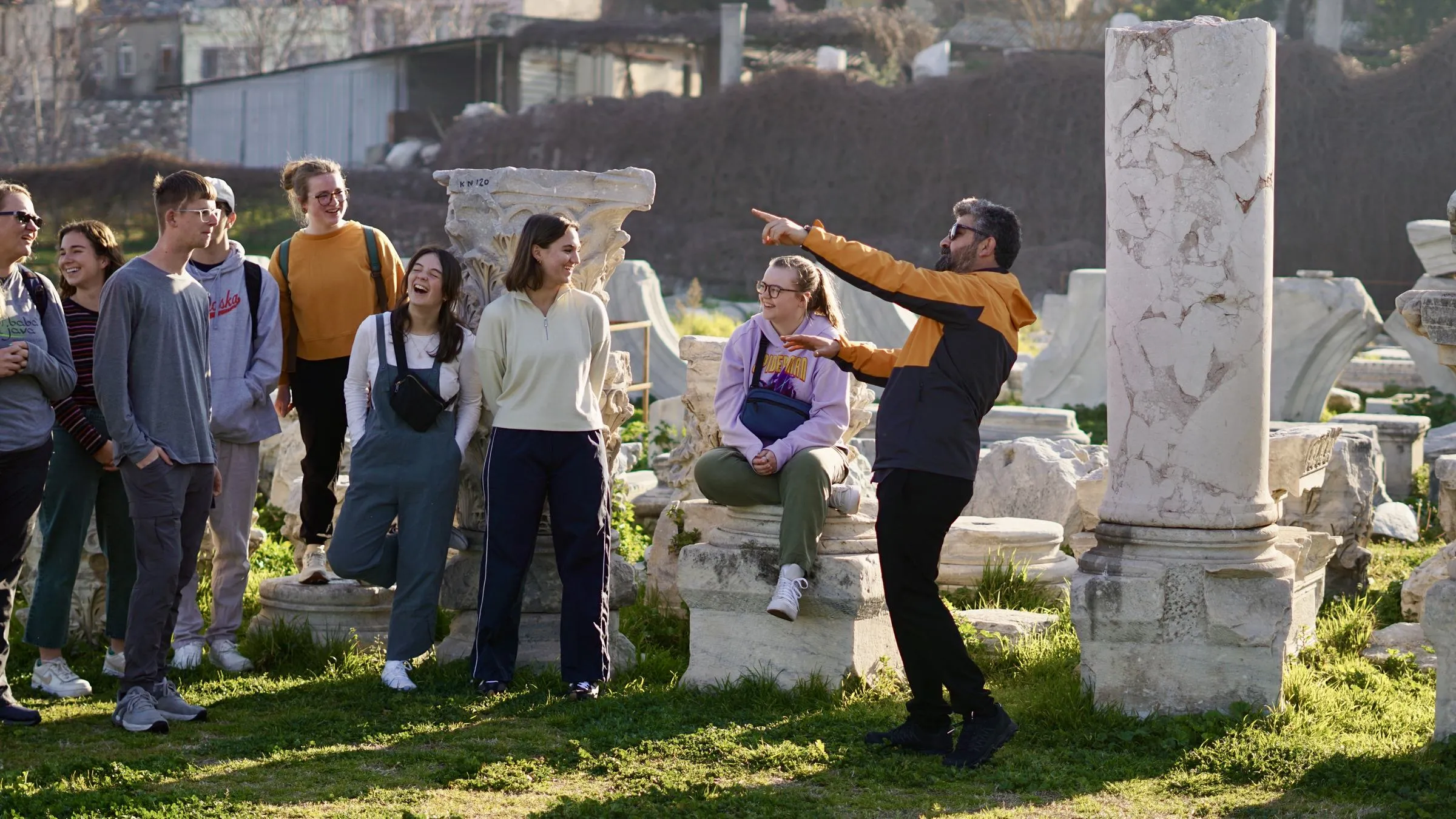 An Enjoy Tours group listening to their guide among fallen columns in the ancient agora of Smyrna