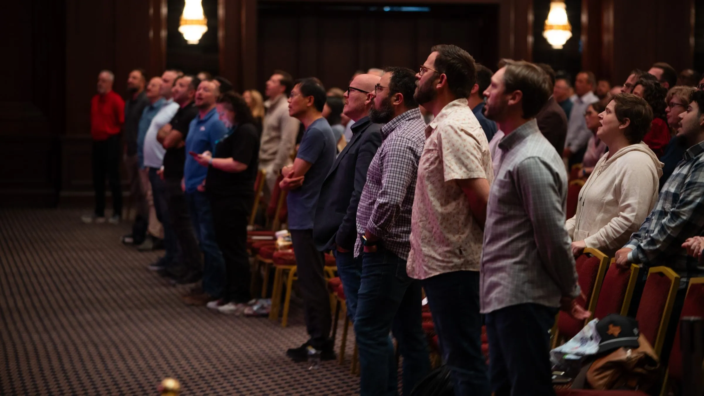 Attendees standing together in the main hall at the Nicea conference