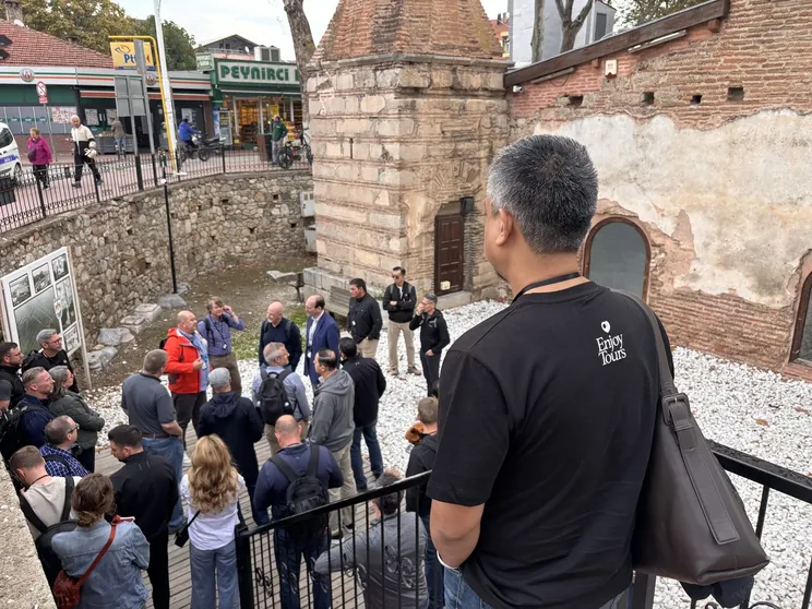 An Enjoy Tours group with their guide among the old brick ruins of İznik, ancient Nicaea, in Turkey