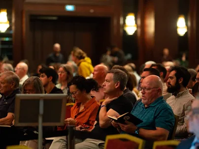 Attendees seated in the Nicea Conference hall