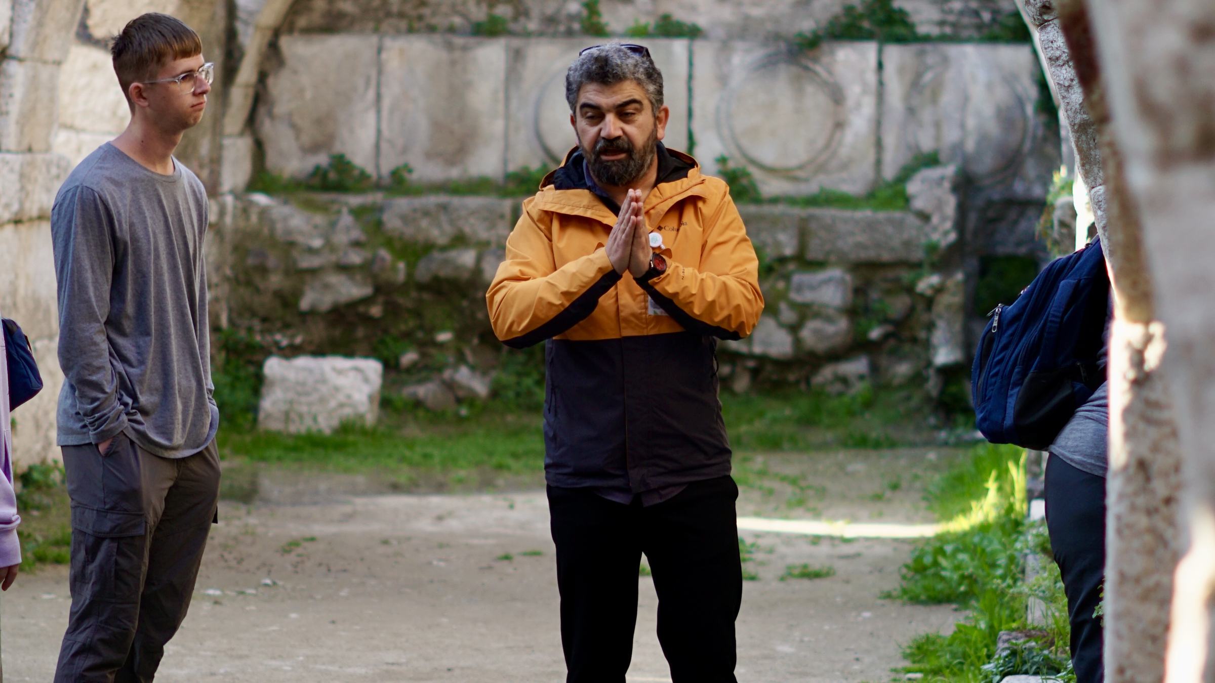 A guide teaching a group in the agora at Smyrna.