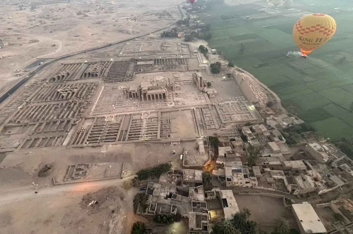 Hot-air balloons at dawn over the Ramesseum on Luxor's West Bank.
