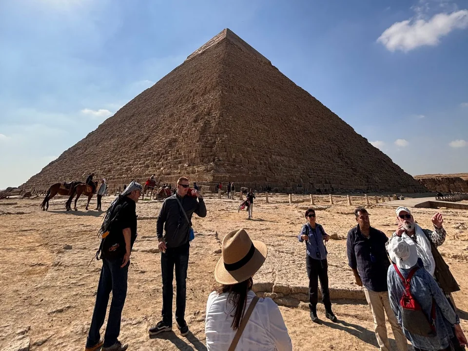 A group with their guide before the Pyramid of Khafre at Giza.