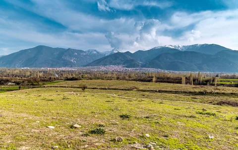The mound of unexcavated Colossae below the mountains