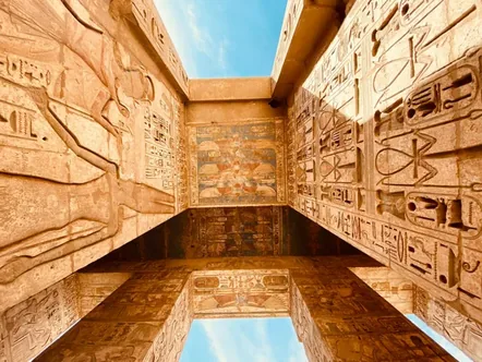 Looking up at carved and painted pillars at Medinet Habu, Luxor. Photo: Mo Gabrail on Unsplash