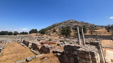 The forum of ancient Philippi with standing columns and the acropolis hill behind