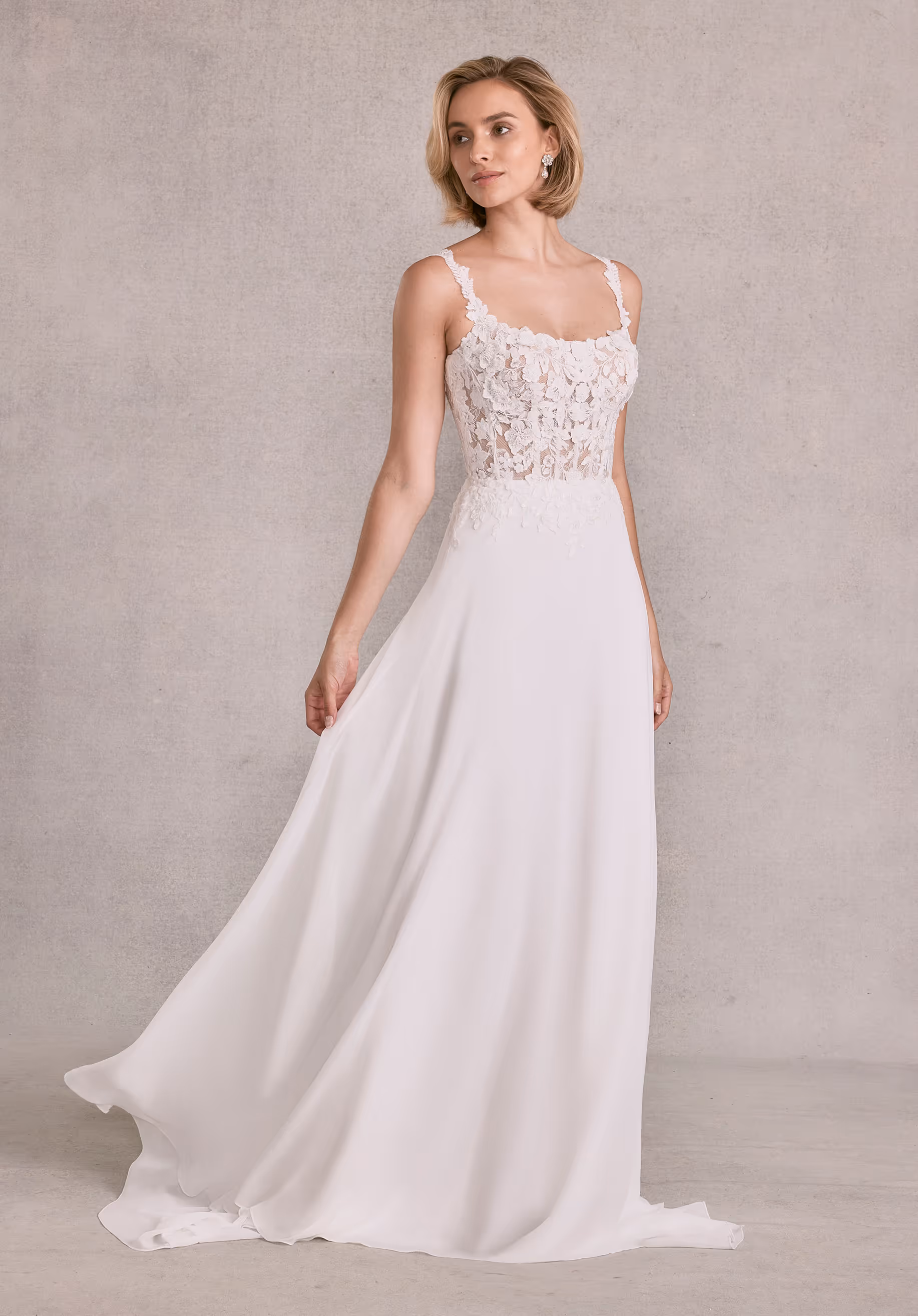 Effortless A-line has a a sheer boned bodice with beaded embroidered 3D floral appliqués and a square neckline on chiffon skirt.