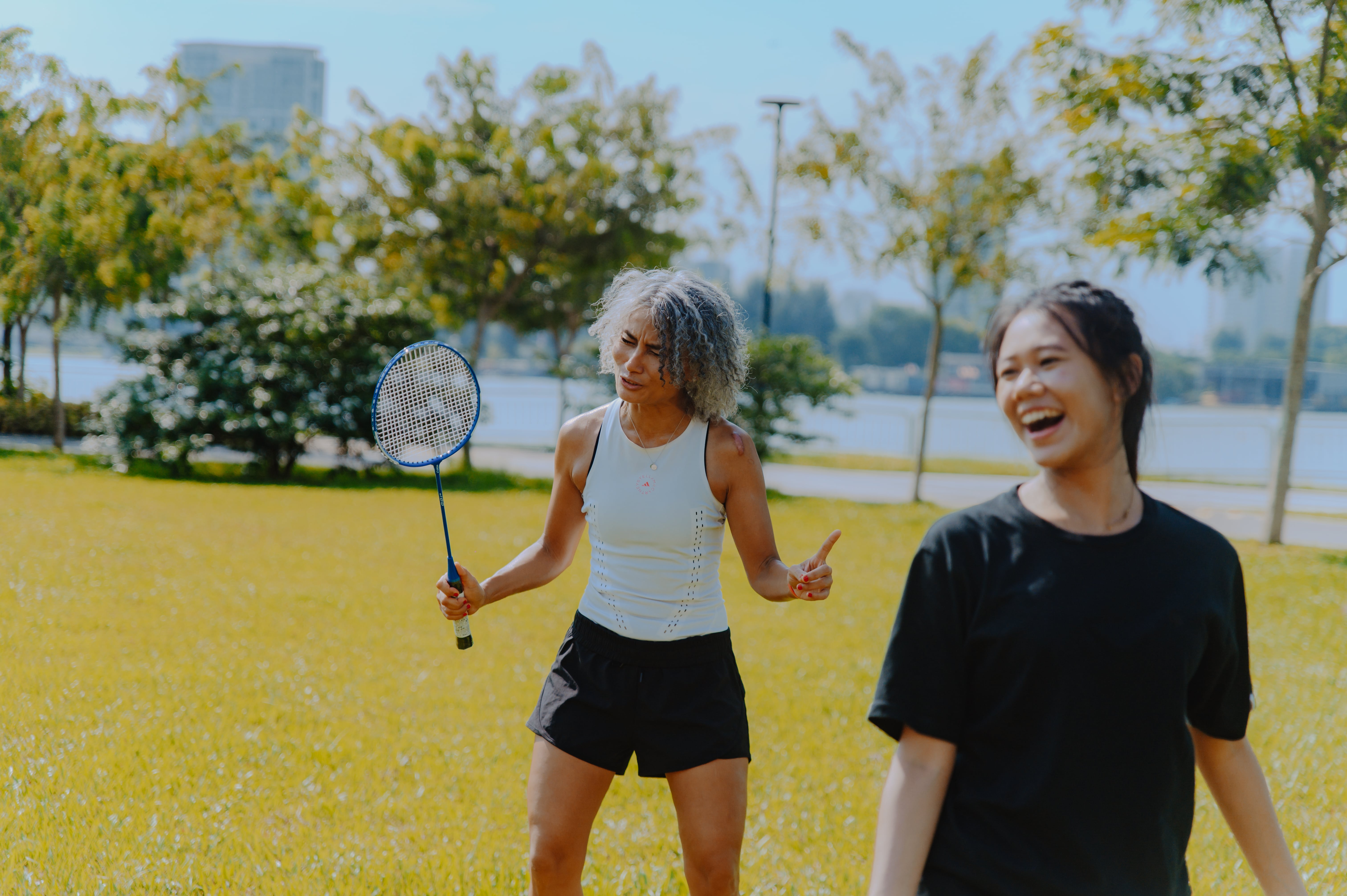 Image of two ladies playing badminton