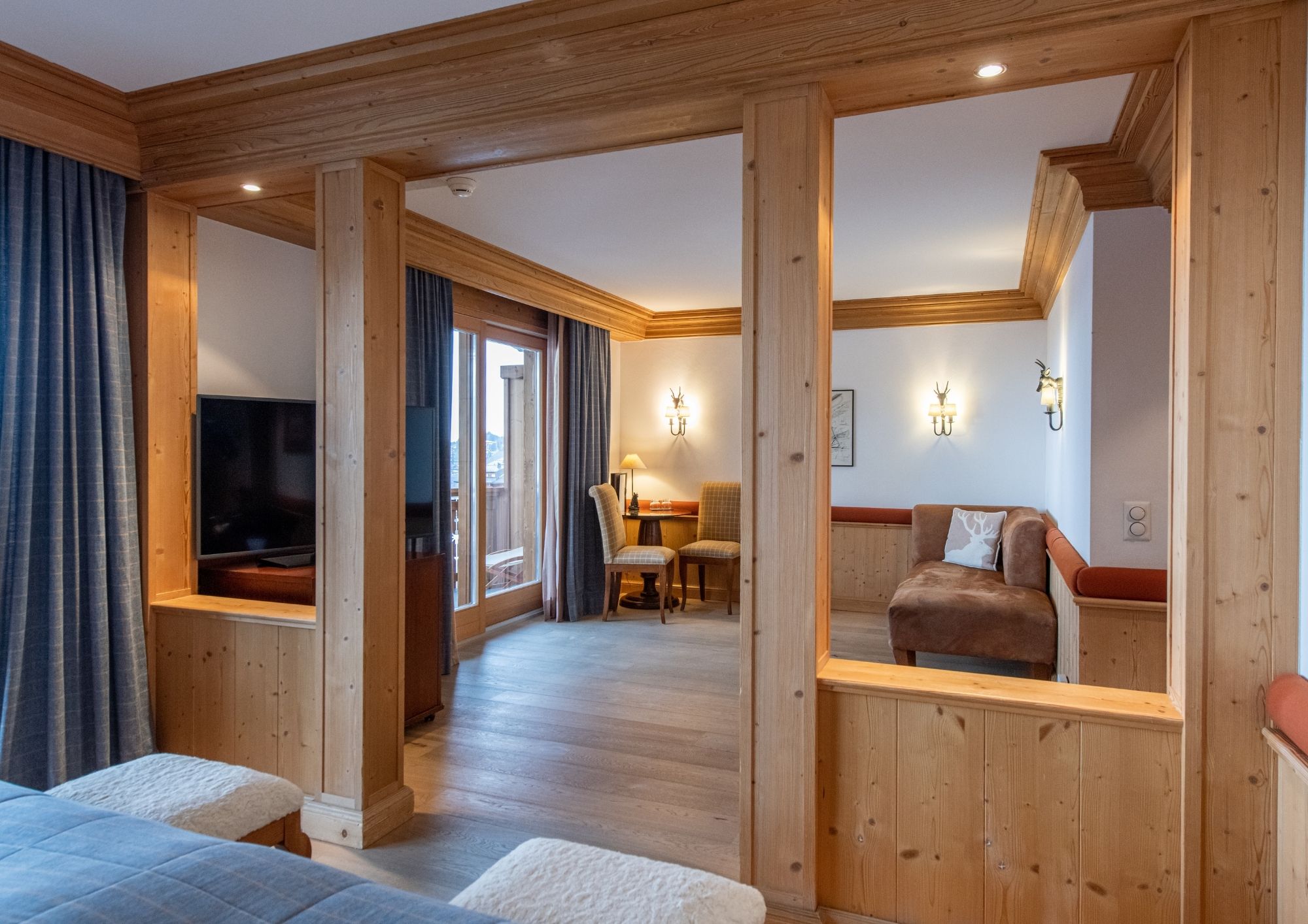 View from the living room of the Junior Suite with mountain views in Chalet Royalp