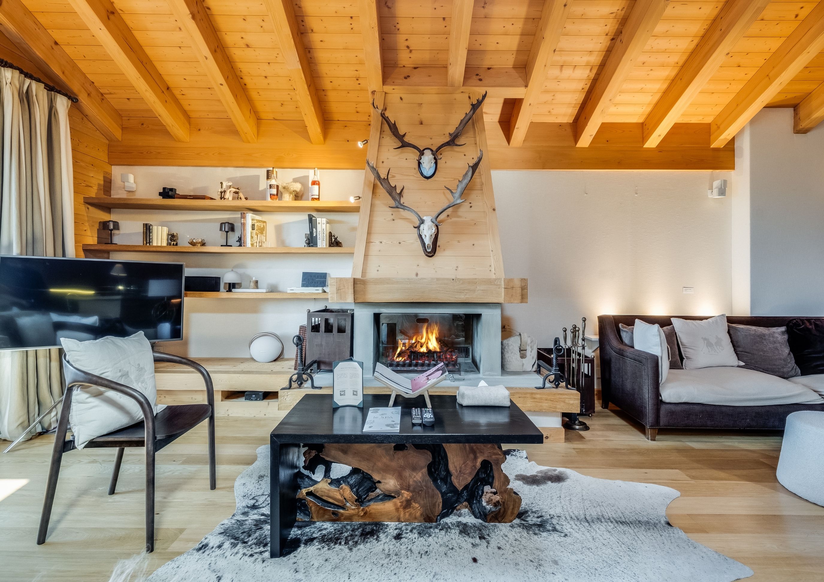 Photo of the fireplace area in the Royal Penthouse at Chalet RoyAlp in Villars-sur-Ollon