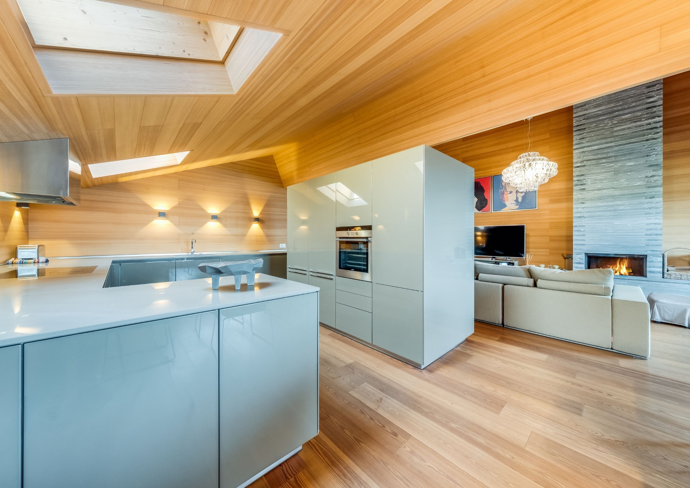 Photo of the kitchen and living area of the modern penthouse at Chalet Royalp in Villars-sur-Ollon