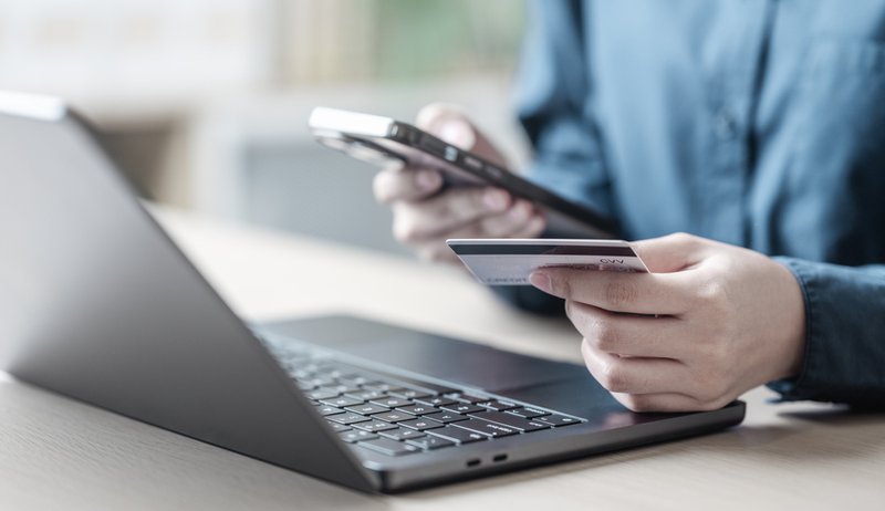 Person making a purchase using a credit card.