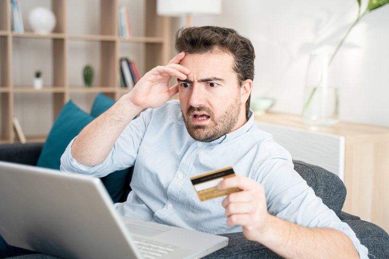 Man discovering he was a victim of payment fraud.