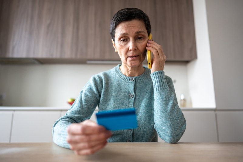 Woman about to be a victim of payment fraud.