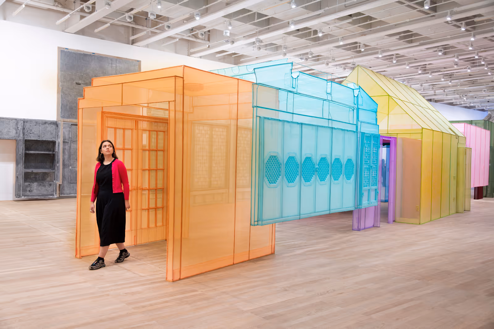 A woman walking through an exhibition