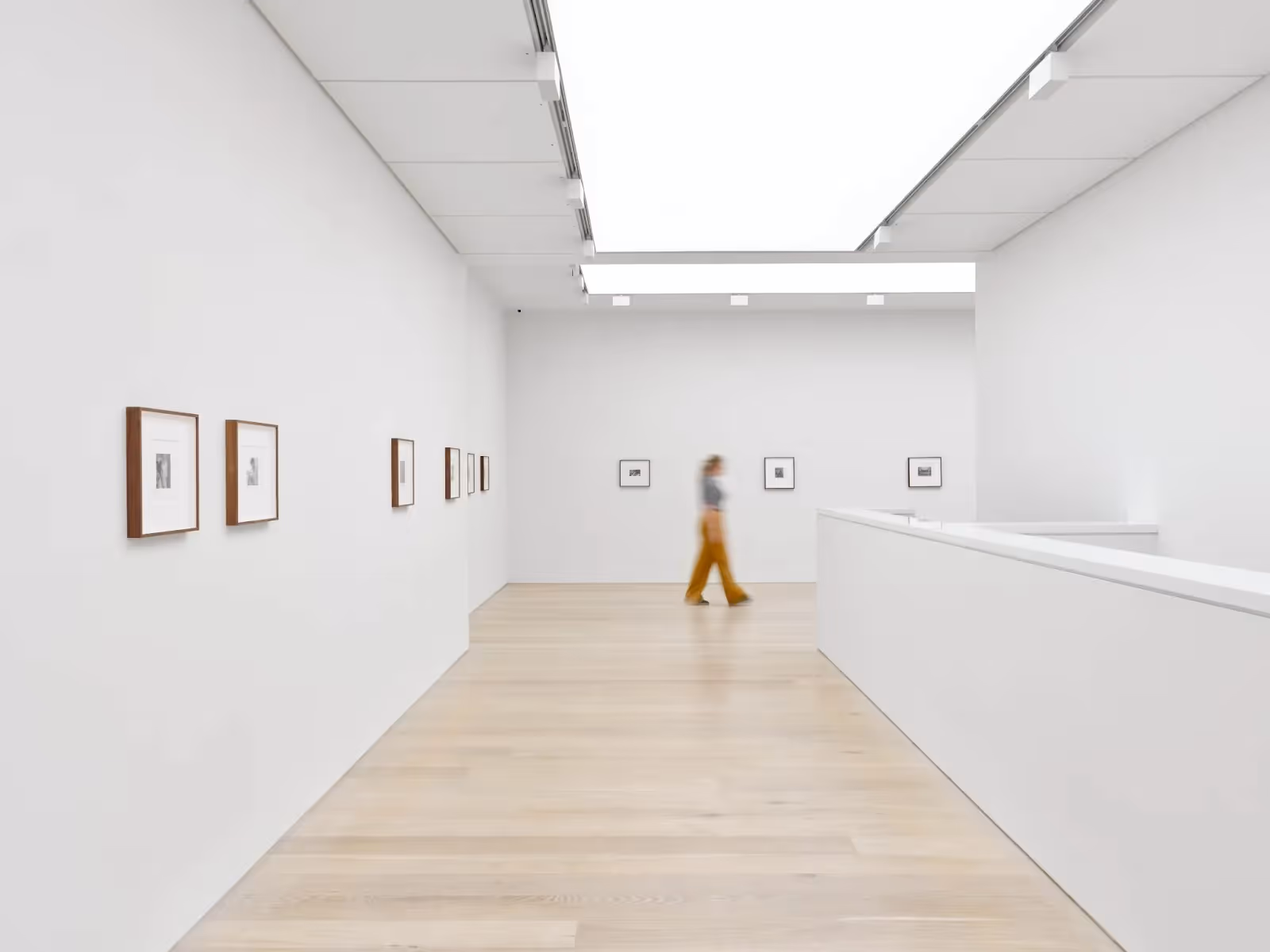 A woman walking through an exhibition