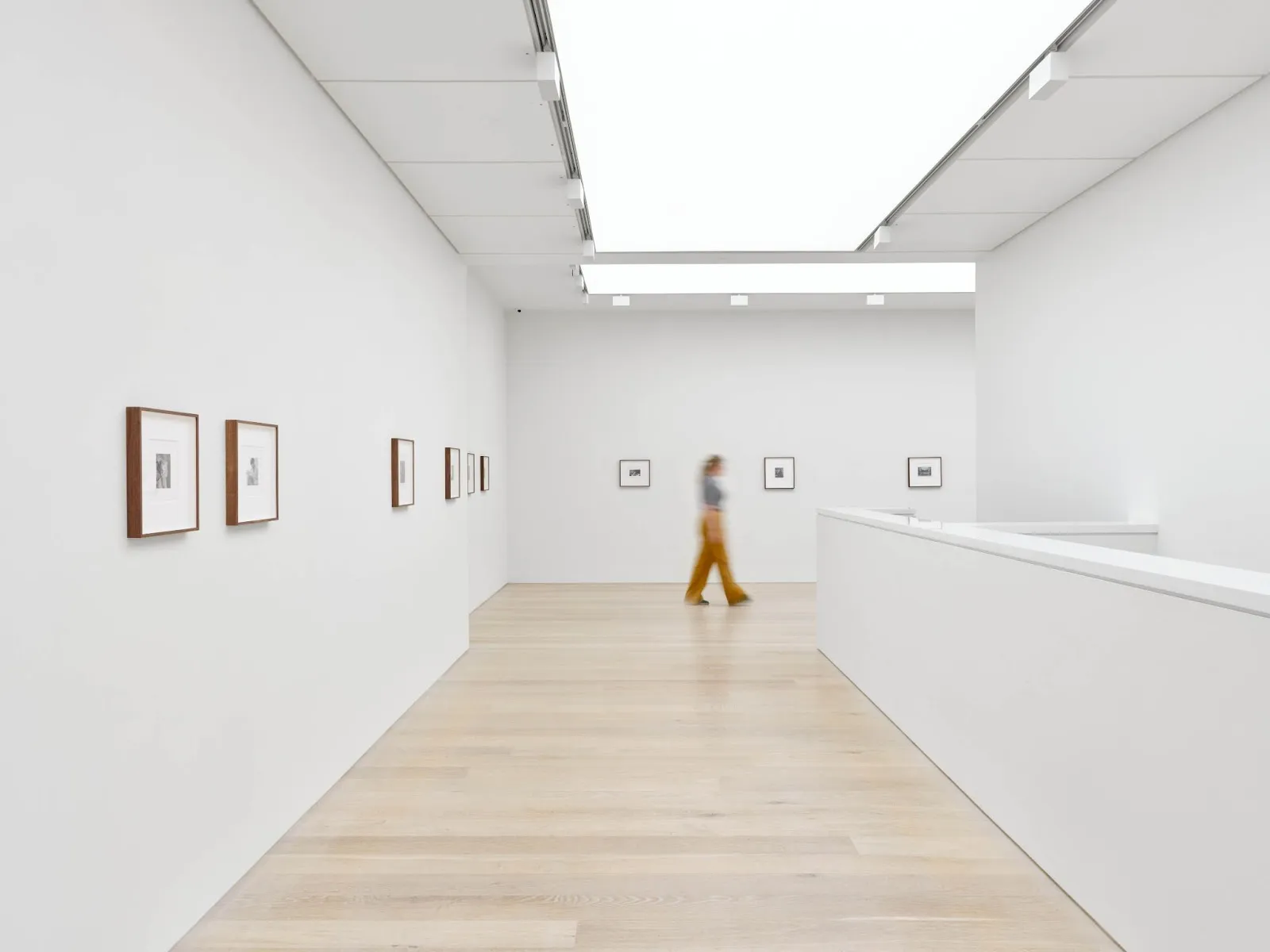 A woman walking through an exhibition