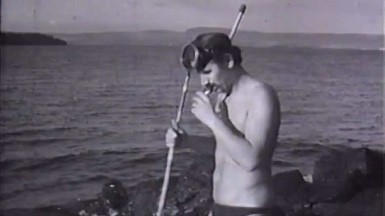 A still from a film showing a man with a snorkle