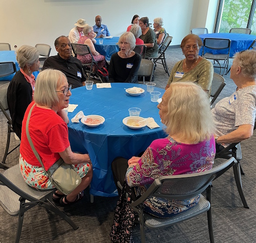 Photo of a table full of people with ice cream