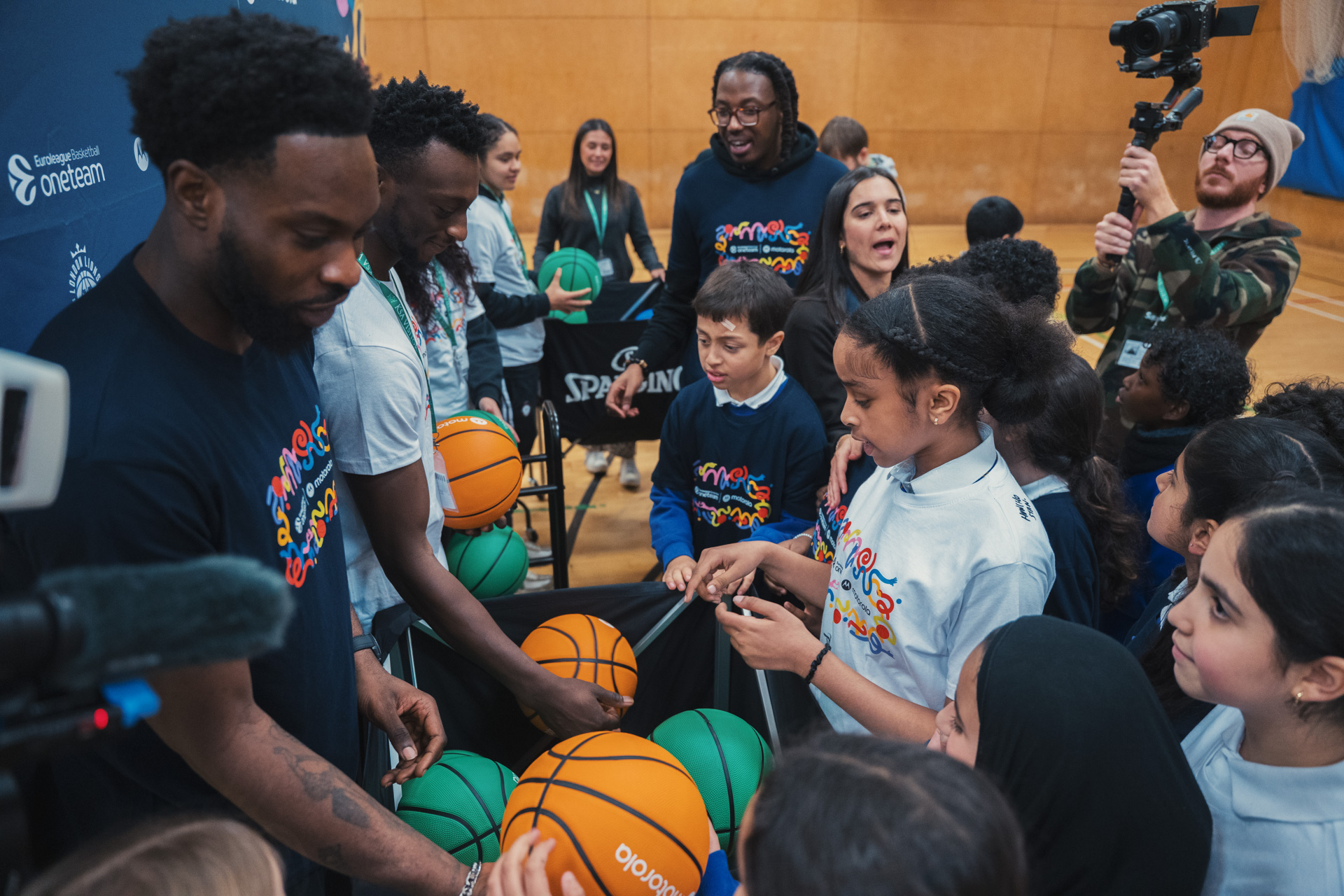 London Lions players signing autographs for school children
