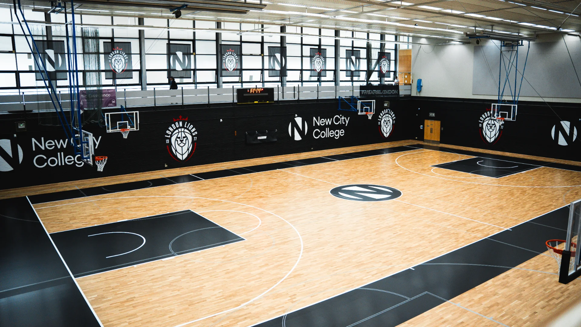 The full-size basketball court inside the sports hall at New City College Hackney, home of the London Lions