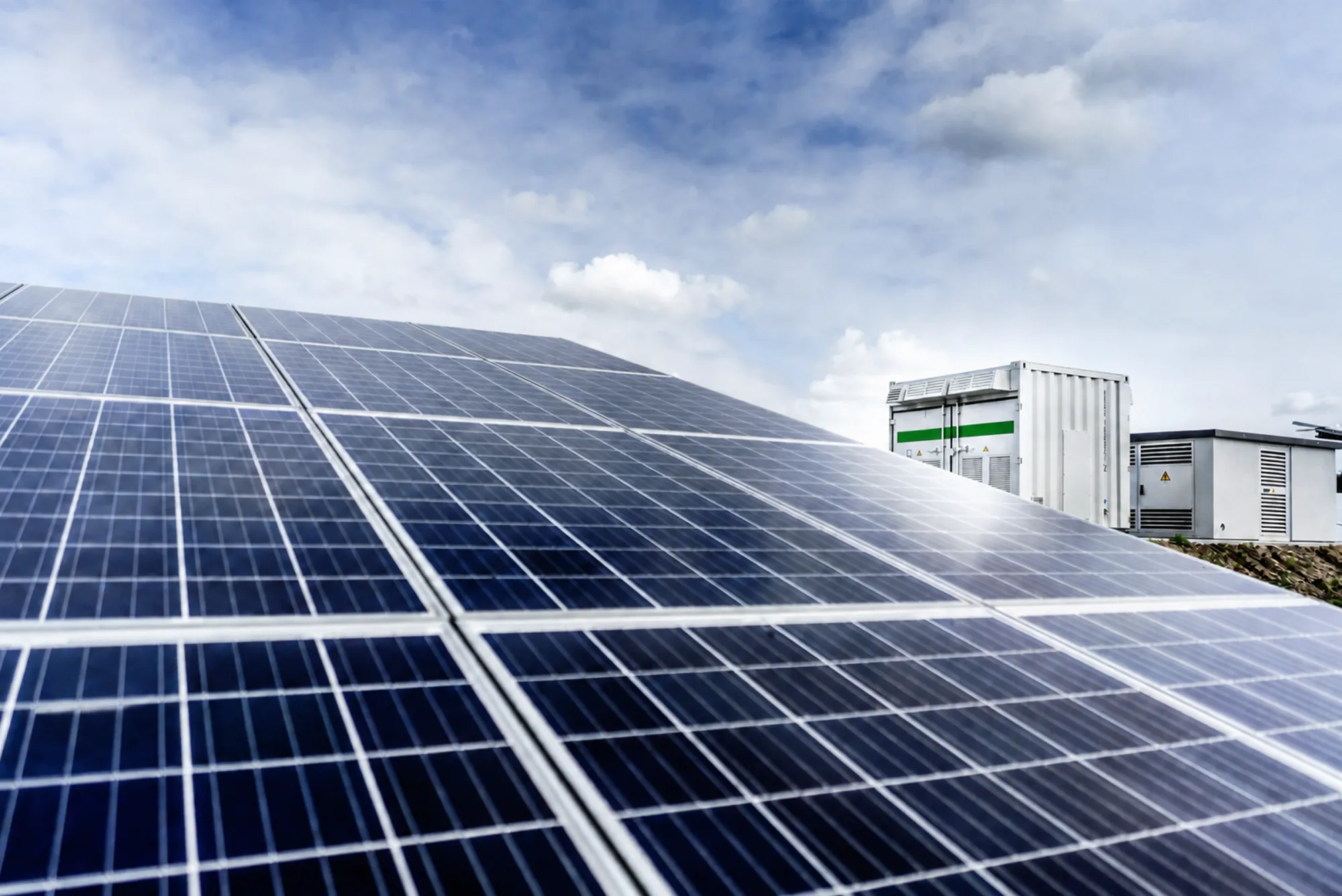 Battery energy storage containers alongside a solar array