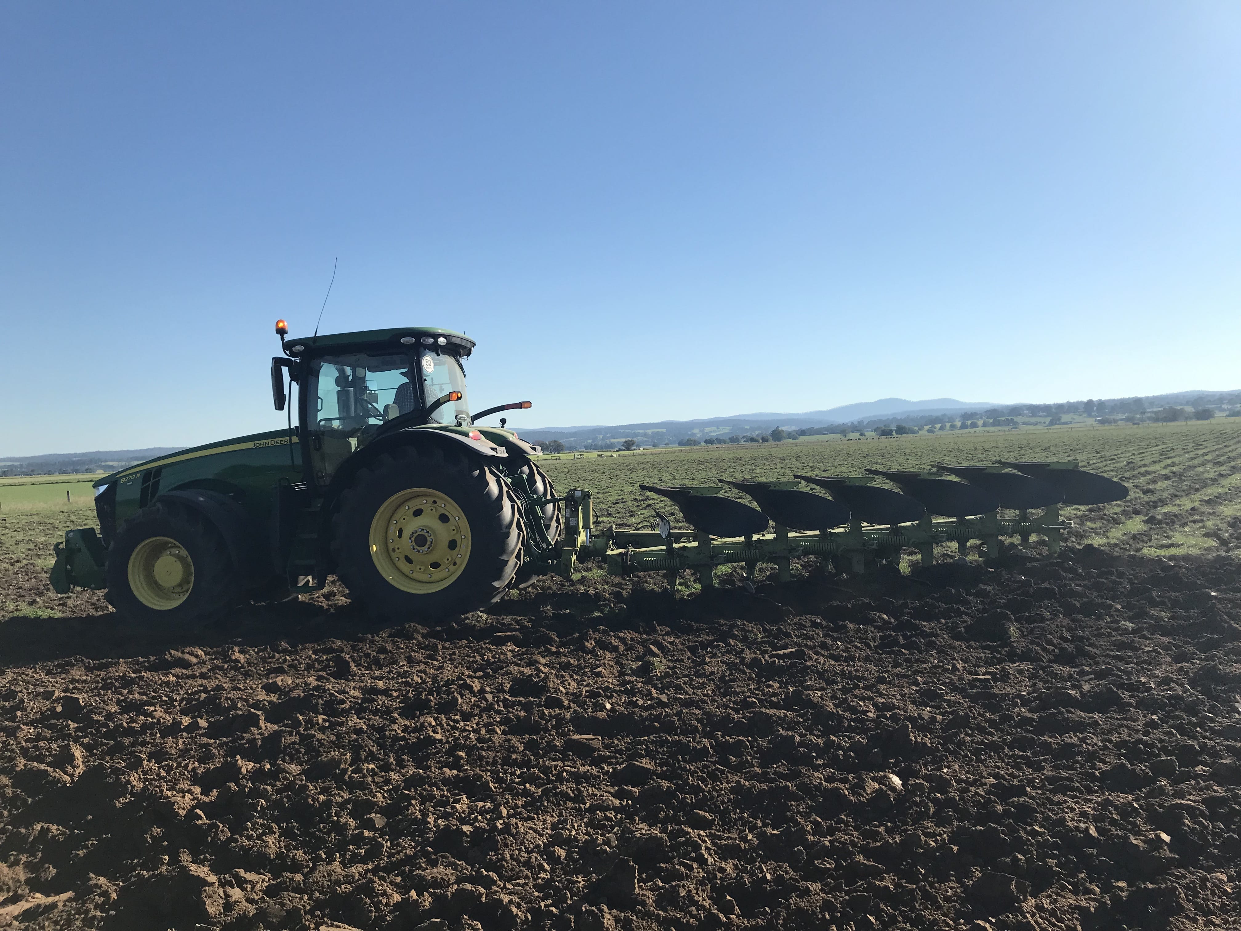 tractor plowing field
