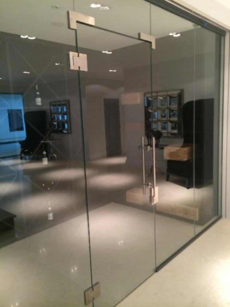 Designed, manufactured and installed fixed glass internal partitions between a swimming pool and lounge