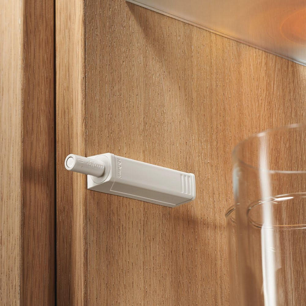 Blum Tip-On latch for doors.