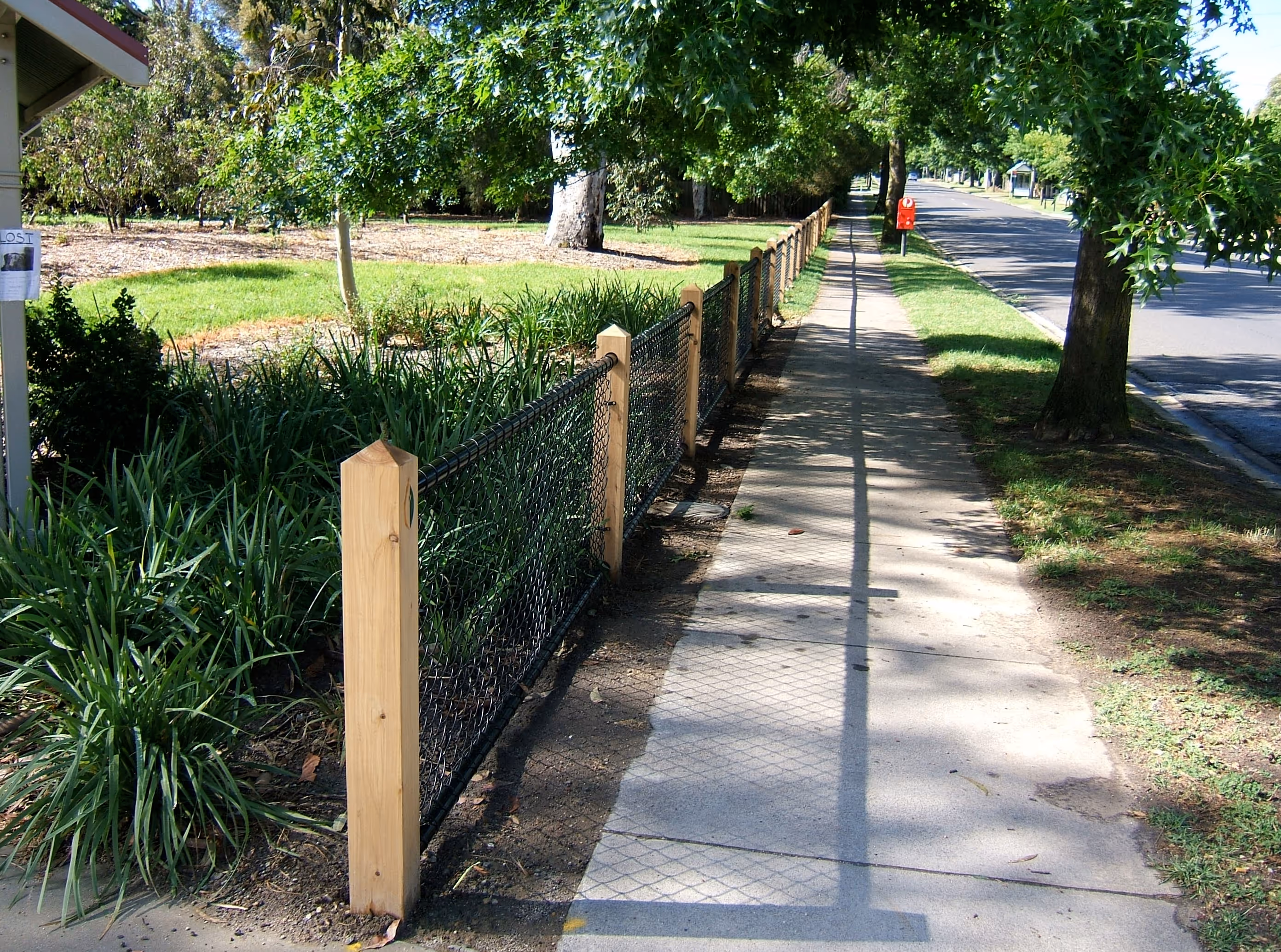 Bollard and pipe rail fence in a park in Epping Melbourne