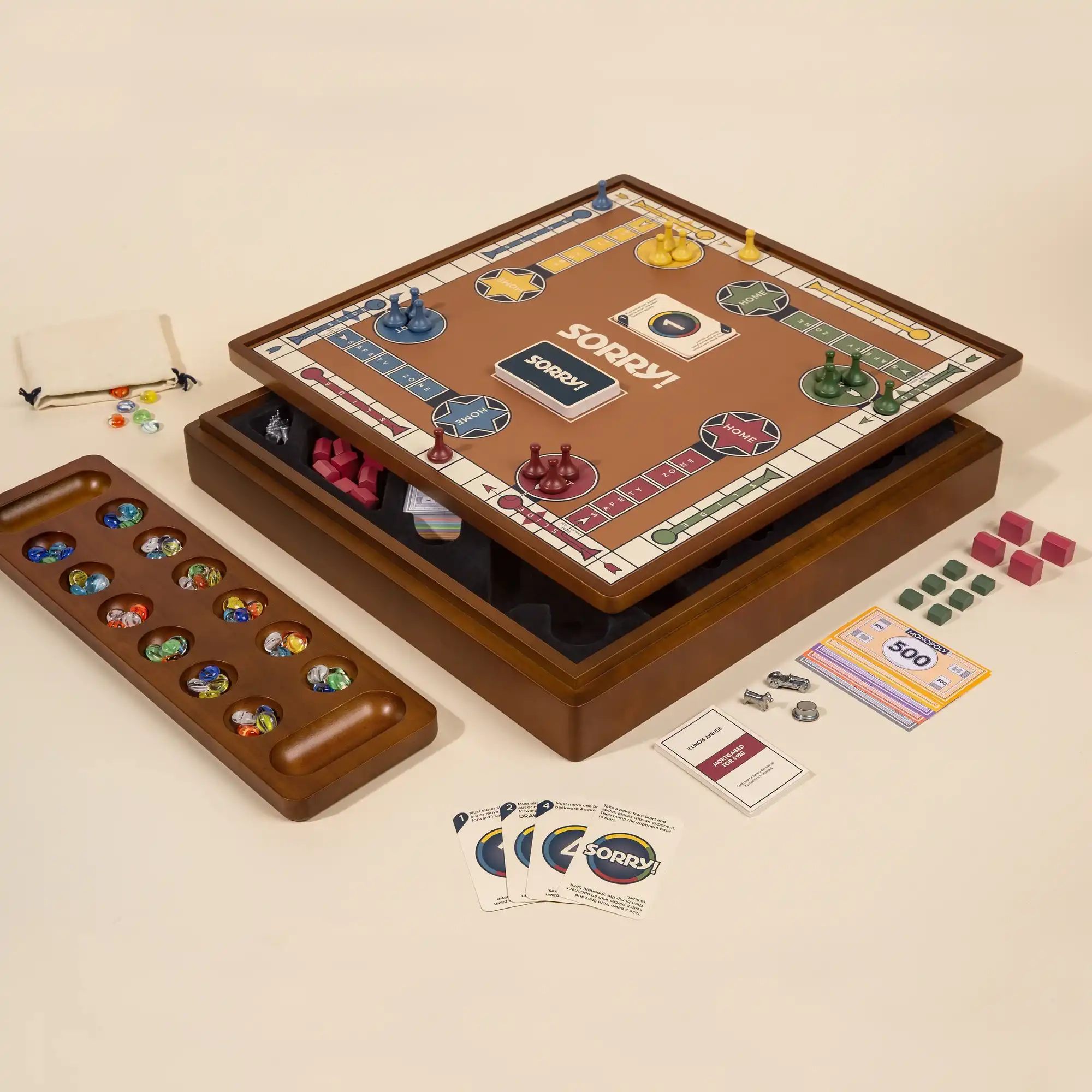 Premium Sorry! board game set on a wood cabinet with a recessed board, game pieces, cards, and a separate wooden Mancala board with colorful marbles.
